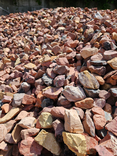Close-up of a wall made of multicolored stones