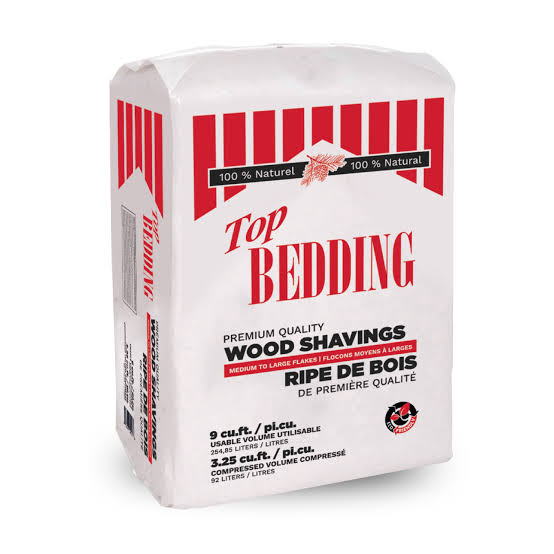 A bag of Top Bedding Premium Quality Wood Shavings, 9 cu.ft. (2.25 m3), shown on a clean white background.