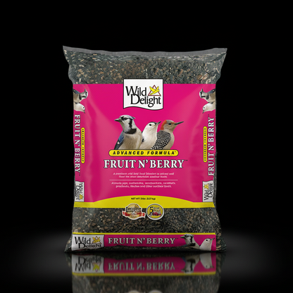 Bag of Wild Delight Fruit N' Berry bird food on a reflective surface with a black background